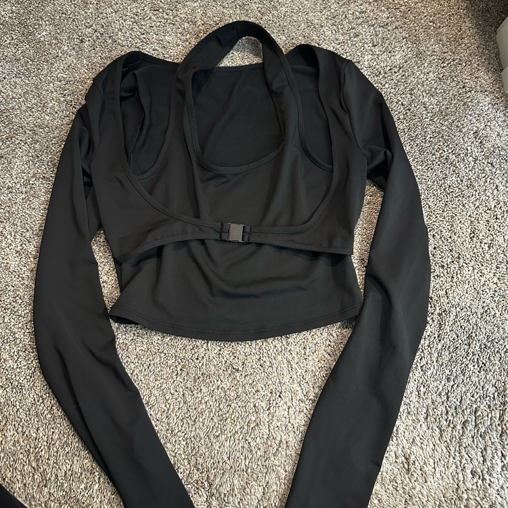 Two different SHEIN black tops ones a work out crop top and another is a blouse